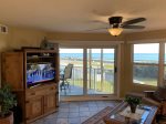Take in some TV and enjoy the waterfront view.